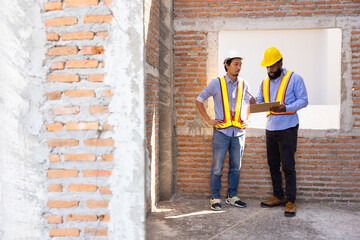 interior design : Architects and contractor working together inside building under construction...