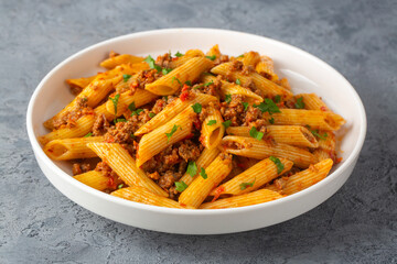 Penne pasta with minced meat looks delicious