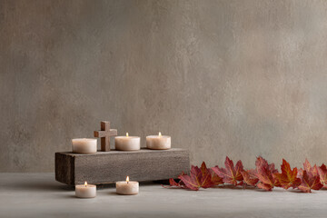 simple wooden shelf adorned with cross and candle surrounded by warm glowing candles creates cozy atmosphere