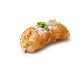 Delicious cannoli with cheese, nuts, powdered sugar and mint isolated on white
