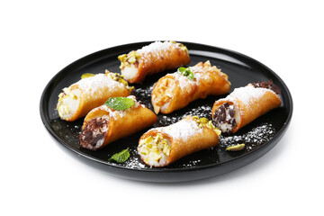 Delicious cannoli with cheese, nuts, powdered sugar, chocolate and mint isolated on white