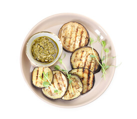 Grilled slices of eggplant with sauce and microgreens isolated on white, top view