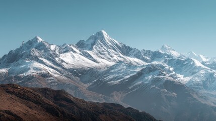 Fototapeta premium Majestic Snow-Capped Mountains Under a Clear Sky