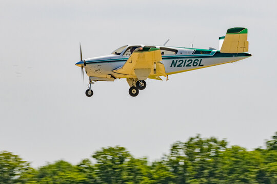 Beechcraft Bonanza V-Tail Light Aircraft in Flight with Gear Down