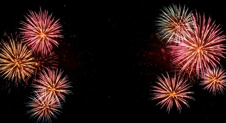 Naklejka premium Various fireworks exploding in the night sky with bursts of red gold and green colors illuminating the dark