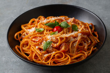 Flat spaghetti pasta with delicious tomato sauce and parmesan cheese.