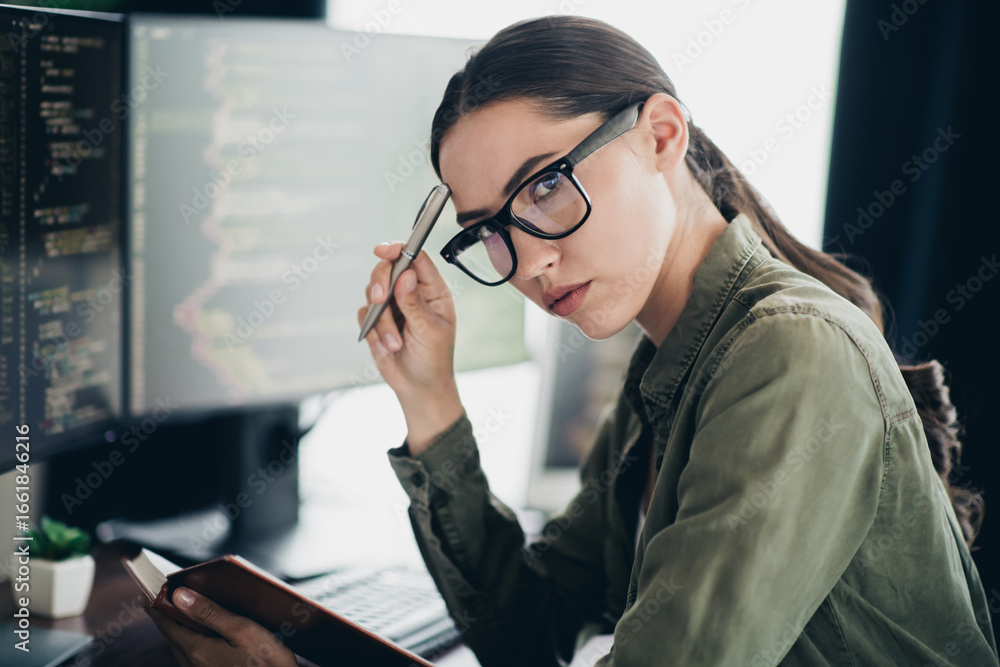 Aufkleber qualified specialist female programmer analyzing code on monitor while working at modern workspace i