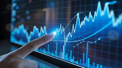 Analyzing stock market data on a screen with finger pointing at the graph chart