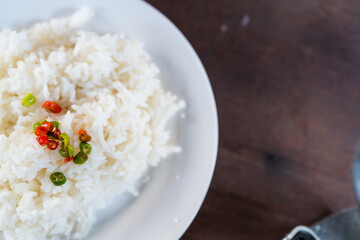Steamed rice sprinkled with a little pickled chili on top