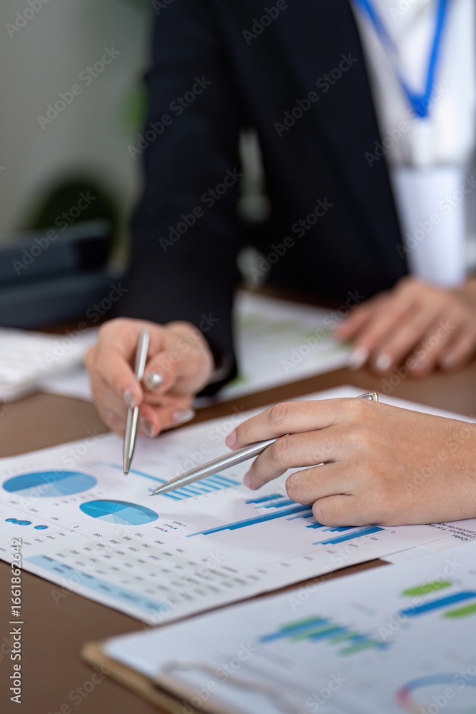 Aufkleber financial advisor analyzing data with client in office setting