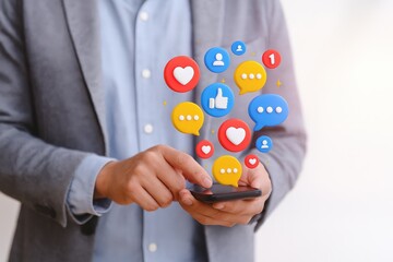 A person interacts with a smartphone, displaying social media engagement indicators like likes and comments in a vibrant, digital overlay.