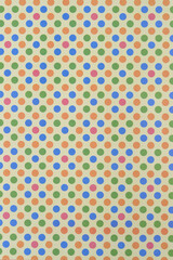 scrapbook paper with dots in blue, green, and orange