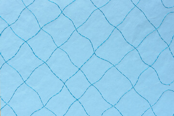 decorative stitched paper with quilted pattern in blue