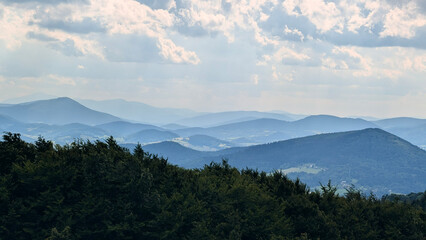 misty mountain ridge with cloudy sky