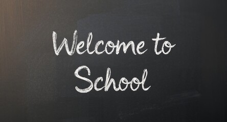 Fototapeta premium Welcome to School on Blackboard. A Message of Education and New Beginnings.