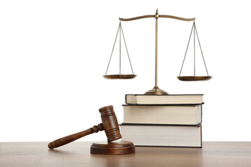Golden scales of justice, books and gavel on wooden table against white background