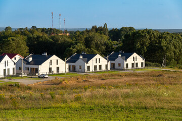 View of newly built modern suburban houses in a quiet residential area.
