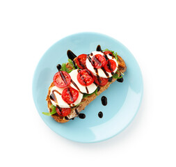 Delicious sandwich with mozzarella cheese, balsamic sauce, tomato and arugula isolated on white, top view