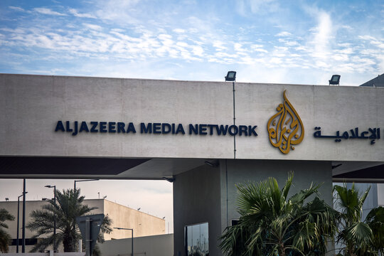 The inscription alJazeera media network on the building. The headquarters of the Al Jazeera TV channel in Doha, Qatar.