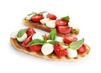 Delicious sandwiches with mozzarella cheese, tomatoes and basil isolated on white