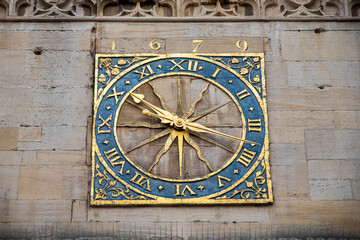 Cambridge, England. Close-up of the original 1679 clock face, blue and gilded hands, on the tower of Great St Mary's Church