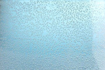 Soda water with bubbles of gas in glass, closeup
