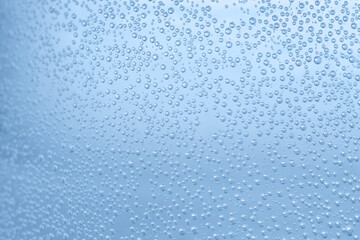 Soda water with bubbles of gas in glass, closeup