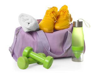 Stylish sports bag with sneakers, towel, bottle and dumbbells isolated on white