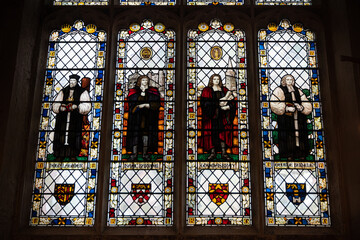 Cambridge, England. Stained-glass window in the north chapel of Great St Mary's featuring figures of Hugh Latimer, Isaac Barrow, Thomas Bray and George Berkeley