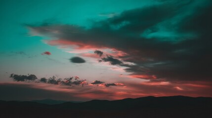Obraz premium A tranquil landscape with a vibrant teal and red sky, dense dynamic clouds, distant hills silhouette,