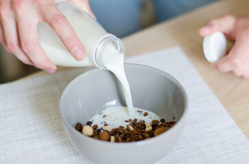 Milk Being Poured into Bowl of Chocolate Granola