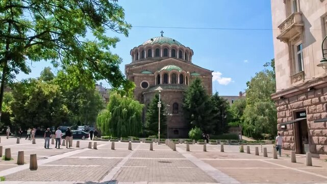 Sofia, Bulgaria - 16.06.2025, Walk through the green public park in front of Sveta Nedelya Church in central part of Sofia. The Orthodox church