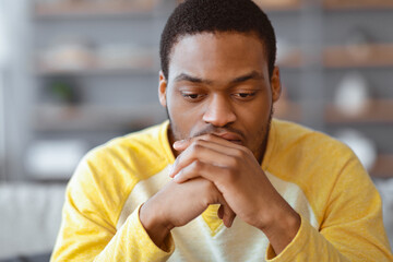 Pensive african american young man thinking about something, closeup portrait, copy space....