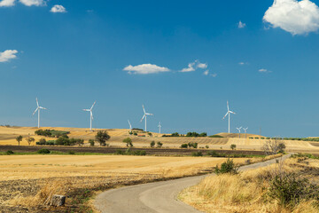 Wind Turbines Generating Clean Energy in Rural Apulia, Italy