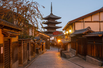 The Yasaka Pagoda in Kyoto at dawn, bathed in soft morning light, with quiet streets and a serene atmosphere, symbolizing the timeless harmony of Japanese tradition and cultural heritage.