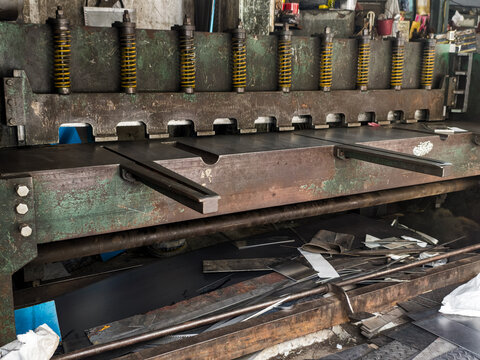 Old Industrial guillotine shear with reinforced blade for metalsheet cut in a structural steel plant