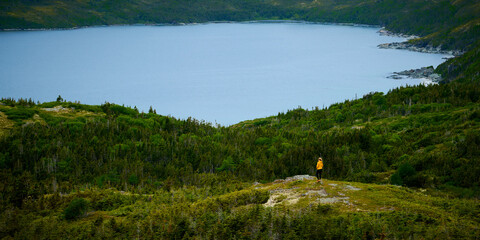 Woman overlooking Cr&eacute;maill&egrave;re Harbor near St. Anthony, Newfoundland.