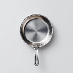 A top-down view of a gleaming, stainless steel frying pan with a single, sleek handle, set against a minimalist white background.  The pan's surface exhibits a subtle concentric circular pattern