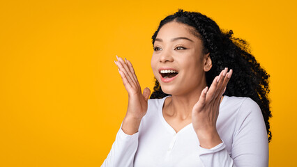 Big Sale. Excited Young Black Woman Looking At Copy Space With Amazement, Surprised African...
