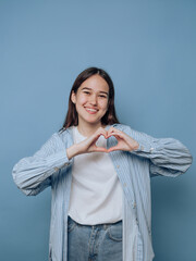 Woman Making Heart Shape with Hands