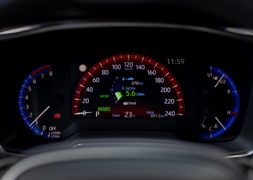 Modern car dashboard with speedometer tachometer and digital display