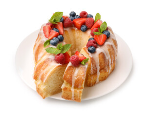 Delicious bundt cake with berries, glaze and mint isolated on white