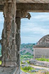 A stone pillar with a carving of a man and woman on it