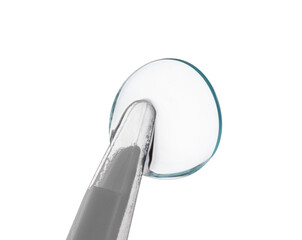 Tweezers with contact lens isolated on white