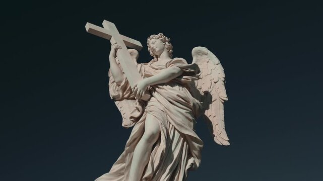 Angel statue with cross on Ponte Sant&rsquo;Angelo, baroque marble sculpture illuminated against dark blue sky in Rome