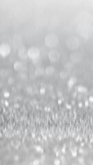 Abstract blurred background of bokeh lights in a soft grey tone