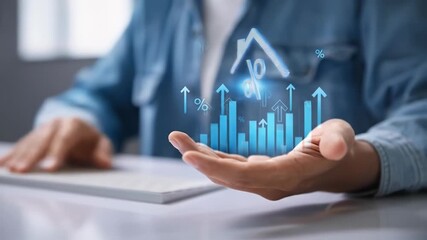 A hand hovers over projected financial data, including a house icon with a percentage symbol, showing upward trends in real estate - Powered by Adobe