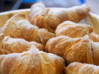 Freshly Baked Croissants in a Wooden Bowl