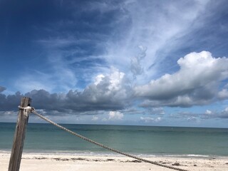 Fototapeta premium beach and sea with rope barrier