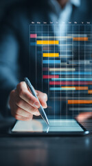 Businessman using stylus on tablet displaying Gantt chart project timeline with colorful bars project management
